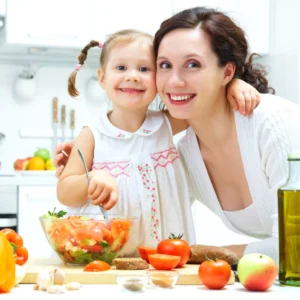 Mother and daughter smiling in a bright kitchen while preparing a fresh vegetable salad together.